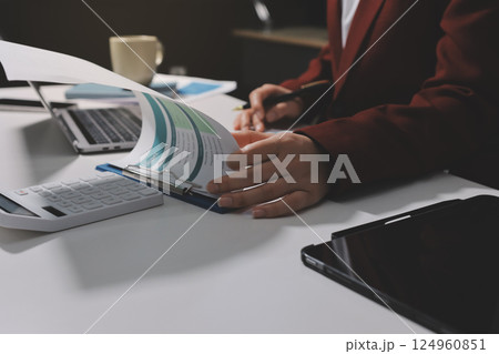 Tax deduction planning concept. Women use a calculator to calculate expenses and taxes to receive tax deductions for personal individual Income. tax return for individual persons.monthly expenses 124960851