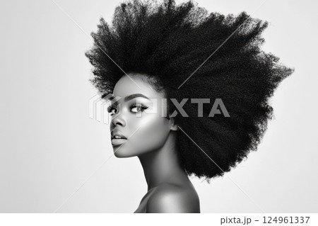 Studio portrait of a young Black woman with natural afro hairstyle and confident expression 124961337