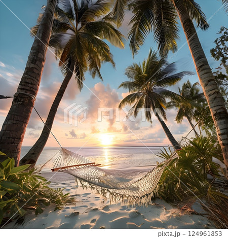 Sunset Serenity: Hammock Between Palm Trees on a Tropical Beach 124961853
