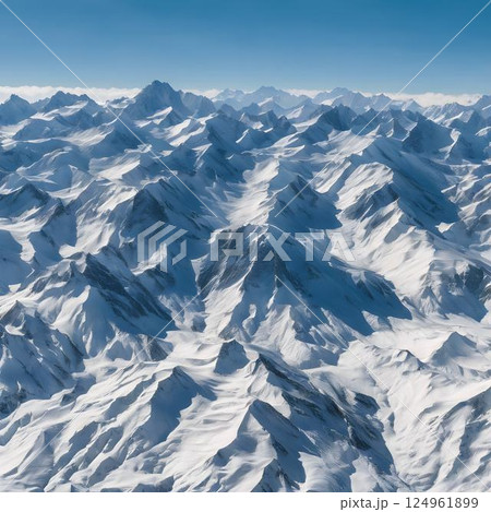 Serenity in Nature: Snow-Capped Mountains and Clear Blue Horizon 124961899