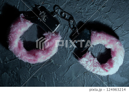 Pink fluffy handcuffs 124963214