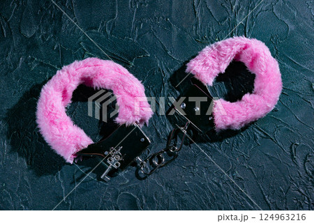 Pink fluffy handcuffs Pink fluffy handcuffs 124963216
