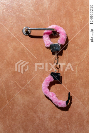 Pink fluffy handcuffs Pink fluffy handcuffs 124963219