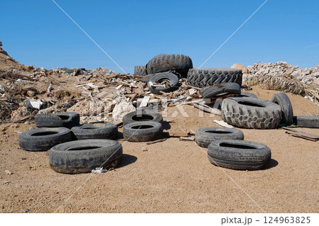 Tyres lies on the dump, abuse of environment Tyres lies on the dump, abuse of environment 124963825
