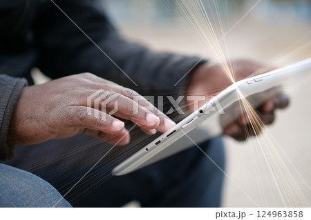 African american man uses tablet computer. Black man hands holds tablet pc 124963858