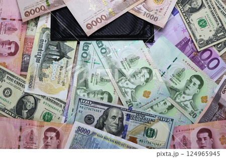 Banknotes of different countries and colors on the table 124965945