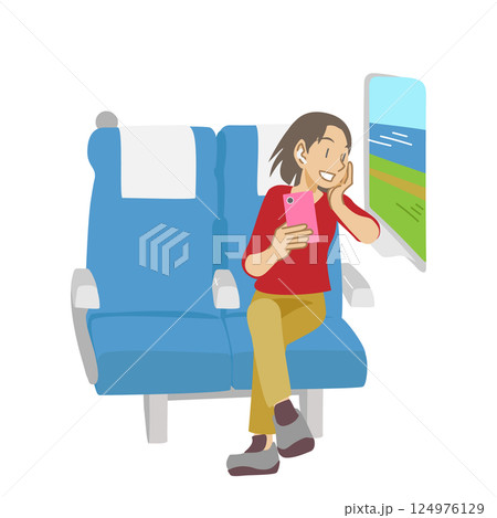 新幹線の座席から景色を眺める女性 124976129