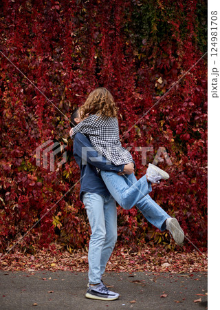 Young Cute Female Hugs Boyfriend. In Autumn Outdoor. Lovers Walking in Park. Attractive Funny Couple. Lovestory in Forest. Man and Woman. Cute Lovers in the Park. Family Concept. Happy Couple. Young Cute Female Hugs Boyfriend. In Autumn Outdoor. Lovers Walking in Park. Attractive Funny Couple. Lovestory in Forest. Man and Woman. Cute Lovers in the Park. Family Concept. Happy Couple. 124981708