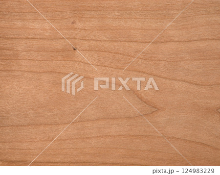 Warm hues and soft grain of American Cherry veneer on wooden texture 124983229