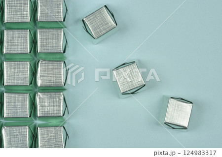 Silver-wrapped candies 124983317