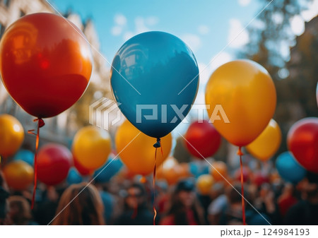 Festive celebration with colorful balloons city park event photography vibrant atmosphere eye-level view joyful gathering 124984193