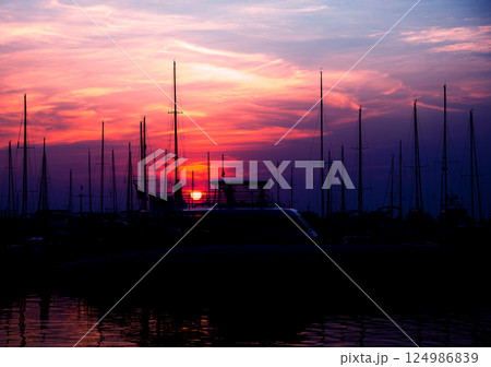 Beautiful view of marina and harbor with yachts and motorboats.  124986839