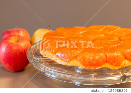 Close-up of apple Tarte Tatin highlighted on neutral background with out of focus apple 124986891