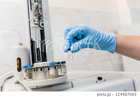 Natural oil quality control. In the industrial laboratory. 124987083