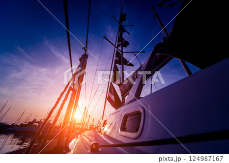 View of harbor with yachts details. Beautiful sunset sky in the marina bay. View of harbor with yachts details. Beautiful sunset sky in the marina bay. 124987167