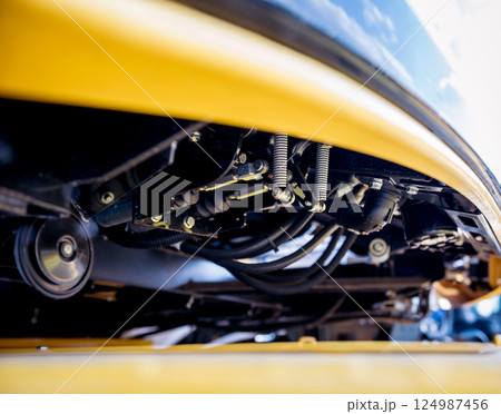 Modern agricultural machinery and equipment. Yellow agricultural harvester. Modern agricultural machinery and equipment. Yellow agricultural harvester. 124987456