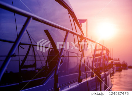 View of harbor with yachts details. Beautiful sunset sky in the marina bay. 124987476