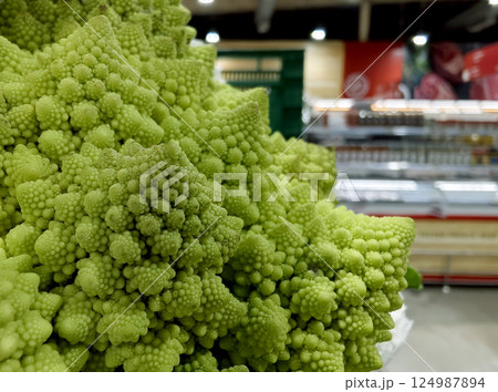 Vibrant green cauliflower on a grocery background 124987894