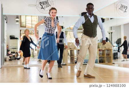 Woman and man dancing swing in studio 124988100