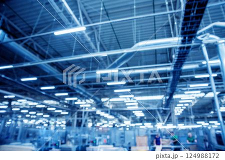 Bloored background of production line of the wooden floor factory. Bloored background of production line of the wooden floor factory. 124988172