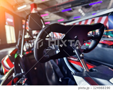 New electric go karts in the modern indoor racing track New electric go karts in the modern indoor racing track 124988190