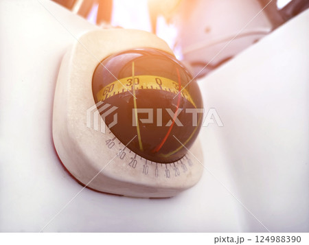 Close-up gyro compass and navigation equipment on an sailing yacht Close-up gyro compass and navigation equipment on an sailing yacht 124988390