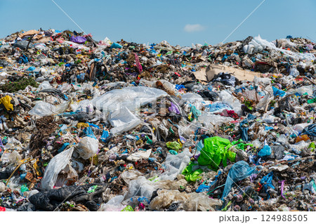 A lot of household waste in the landfill. The problem with waste processing. The topic of waste processing and pollution of the planet 124988505