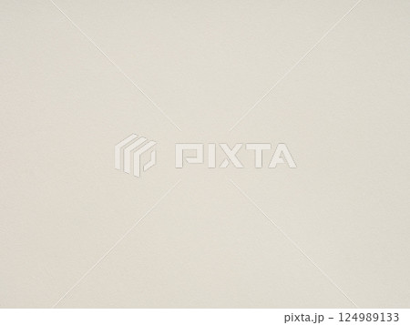 Unruffled whispers of ivory, the paper's texture promises tales untold amidst its understated canvas 124989133