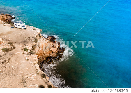 Camper on coast in Spain. Aerial view Camper on coast in Spain. Aerial view 124989306