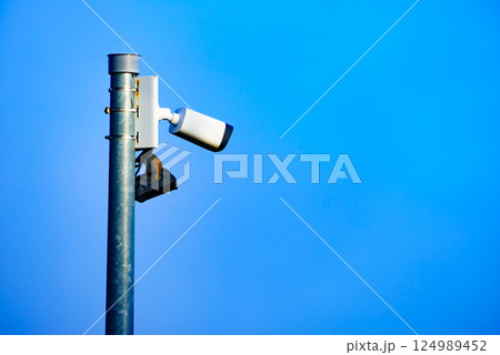 Security video camera against sky. Security video camera against sky. 124989452