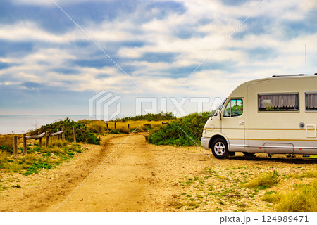 Rv motor home camping on beach 124989471