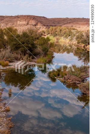 Clouds reflected in the Fish river Clouds reflected in the Fish river 124990030