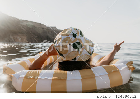 Woman Inflatable Raft Sea Pointing 124990312