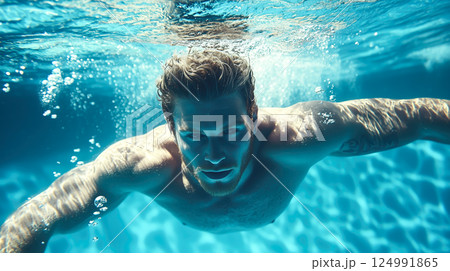 A professional male swimmer glides through the water in a swimming pool with strength and precision. The concept of athleticism, endurance, and the dedication of competitive swimming. Generative AI. 124991865