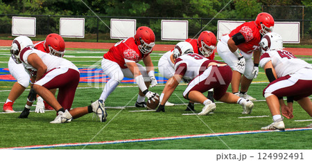 High School Football Teams Starting a New Play on a Turf Field High School Football Teams Starting a New Play on a Turf Field 124992491