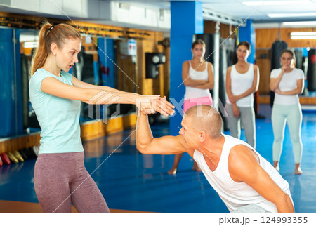 Woman doing wristlock movement 124993355
