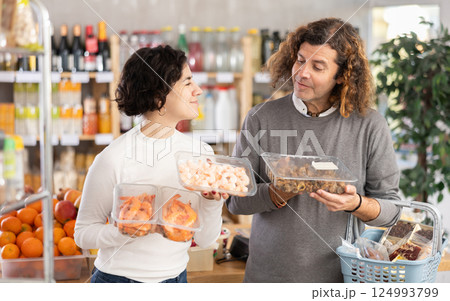 Couple chooses shrimp and sea snails Couple chooses shrimp and sea snails 124993799