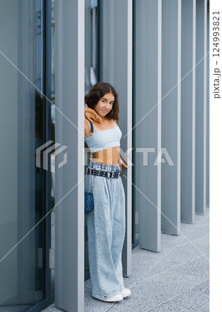 Smiling Girl Posing By Columns Smiling Girl Posing By Columns 124993821