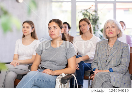 In audience, students sit staring at teacher and listen to lecture In audience, students sit staring at teacher and listen to lecture 124994019