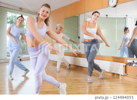 Dynamic middle-aged woman dancing hip-hop 124994055