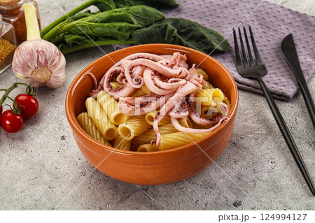 Italian cuisine - pasta tortiglioni with squid Italian cuisine - pasta tortiglioni with squid 124994127