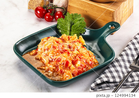 Shakshuka with tomato for breakfast 124994134