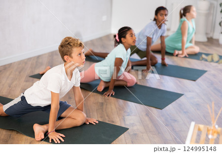 Kids yoga one legged king pigeon pose or eka rada rajakapotasana. 124995148