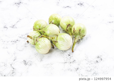 Small organic young green round eggplant Small organic young green round eggplant 124997954