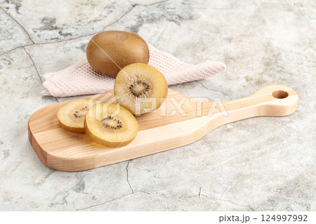 Tasty sweet yellow Kiwi fruit 124997992