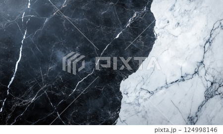 Polished black and white marble surface with bold contrasting patterns, showcasing elegance and sophistication in design. Perfect for interior decor and luxury settings 124998146