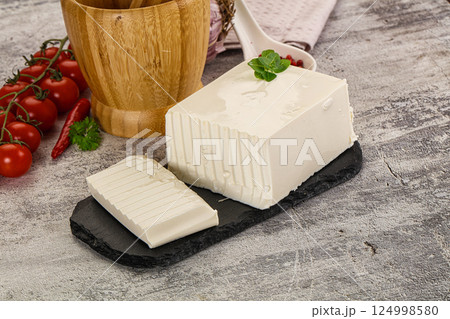 Soft Feta cheese piece with cut 124998580