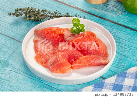 Delicous sliced salmon fillet ready to eat Delicous sliced salmon fillet ready to eat 124998735