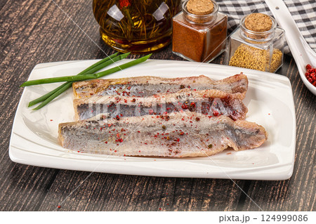 Salted marinated herring fillet with spices 124999086