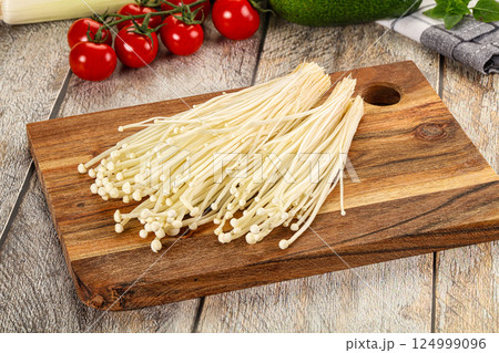Raw enoki mushroom for cooking 124999096